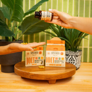 hand giving package of product to another hand