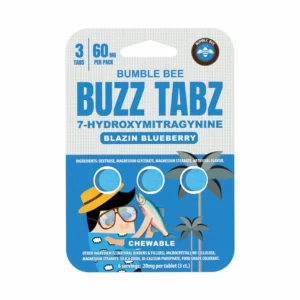 A close-up shot of a small, rectangular package of "Bumble Bee Buzz Tabz" in "Blazin Blueberry" flavor. The packaging is primarily light blue and white, featuring a cartoon bumblebee character wearing a yellow hat and sunglasses in the bottom left corner. The product name "BUZZ TABZ" is prominently displayed in large, bold letters in the center, with "7-HYDROXYMITRAGYNINE" written below in a smaller font. Above the product name are the numbers "3" and "60" separated by a vertical line, with "TABS" below the 3 and "MG PER PACK" below the 60. The flavor, "Blazin Blueberry," is indicated in a blue burst shape. A small, light-blue fish graphic points toward the "CHEWABLE" descriptor near the bottom. The ingredients are listed in small text on the back, which wraps around to the right side of the image. On the right side of the package, there is a small palm tree graphic and three blue circles that appear to be punches or perforations. The Bumble Bee logo is visible in the top right corner. The overall design is playful and eye-catching, promoting a supplement product.