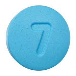 front of single tablet of Ultra Seven Kratom 7-OH Tablets Blue Raspberry 7mg